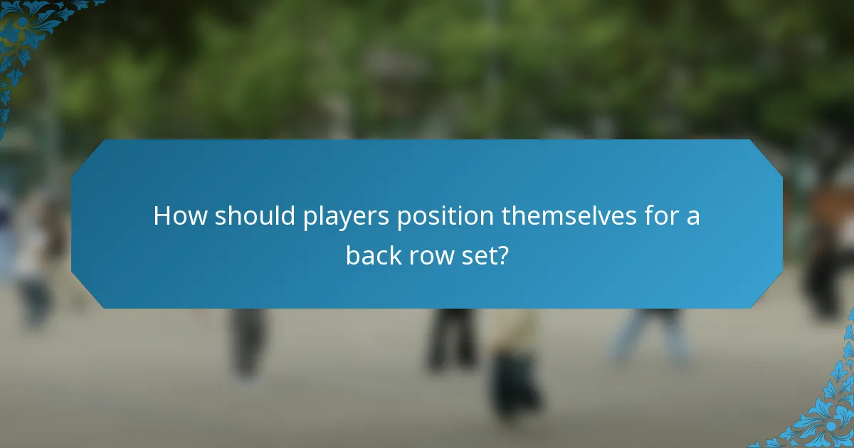 How should players position themselves for a back row set?